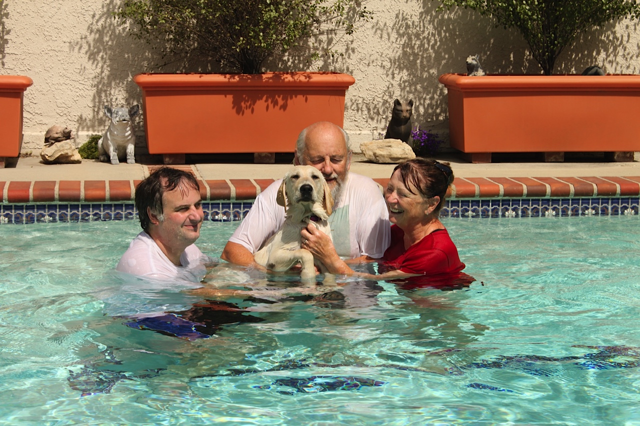 Tim, Mike, and Brenda with Dreamer V in the pool