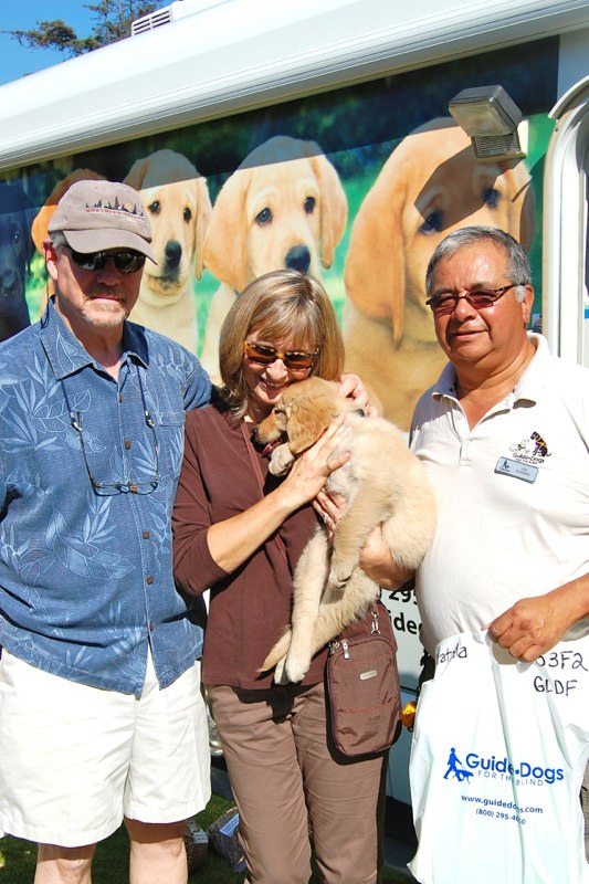 Peggy and Greg with Natalia II at the Puppy Truck