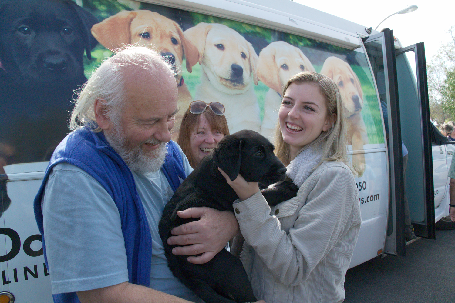 Mike, Brenda, and Katherine with Dash VI at the Puppy Truck